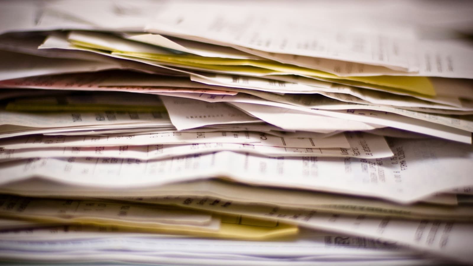 A close-up of the edges of a thick pile of documents